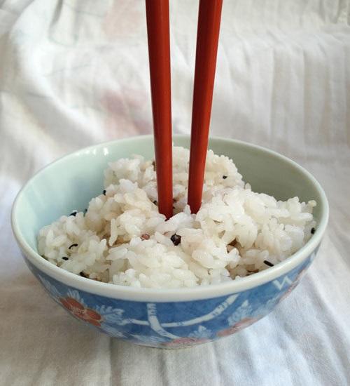 Sticking chopsticks upright in a bowl of rice