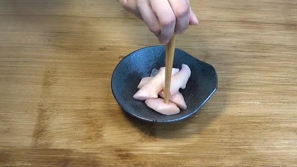 Stabbing food with chopsticks