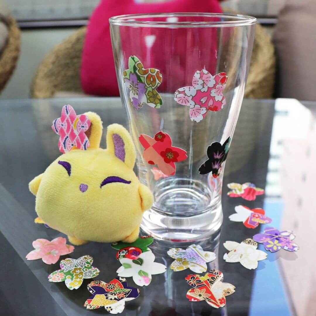 Luna decorates a glass with stickers from ZenPop's April Stationery Pack